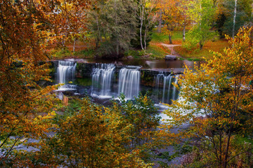 Golden autumn. Waterfall Keila - Joa top view. Attraction in Estonia. Autumn.