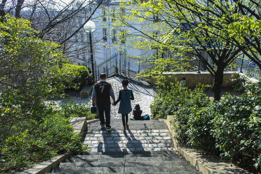 Paris, France. Couple of French People Walking downstairs in Belleville Park Scenes, Springtime