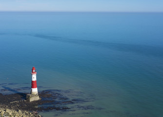 Lighthouse on a sunny day in Seven Sisters, England.