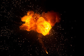 Realistic fiery explosion over a black background - obrazy, fototapety, plakaty