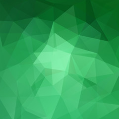 Fototapeta na wymiar Abstract background consisting of green triangles. Geometric design 