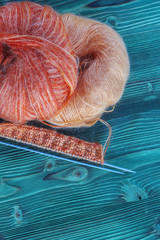 Knitting orange mohair wool and needles
