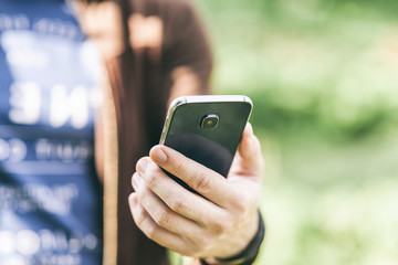 Man's hand holding mobile smartphone