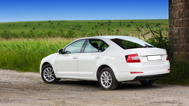 Rear-side View Of A Car On Nature