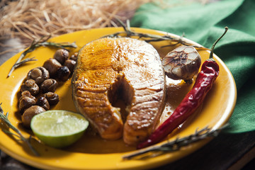 Baked salmon steak with stir-fry veggies. Viewed from above.