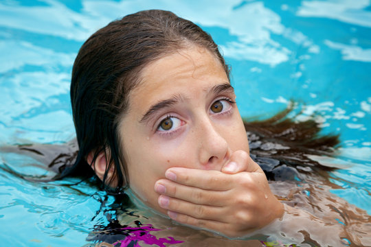 Tween Covering Her Mouth