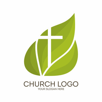 Church logo. Christian symbols. Cross on a background of green leaves
