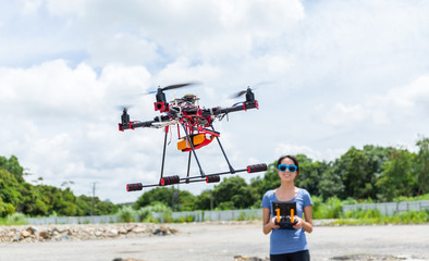 Woman play with flying drone