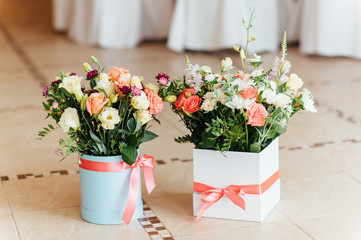 Two beautiful bouquet of bright flowers in basket