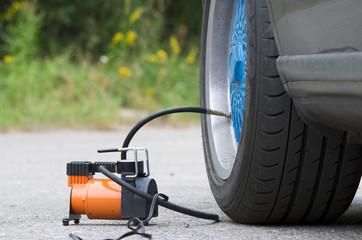The air compressor to inflate automobile wheels