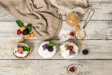 beautiful muffins with berries on wooden background nuts honey