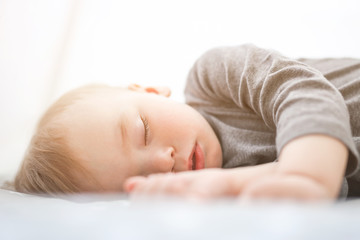 Sleeping baby in his crib,