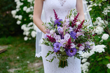 bride holding a wedding bouquet close up