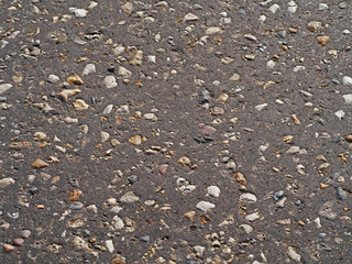 old asphalt background and stones