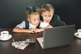 Business or school kids uses a laptop computer