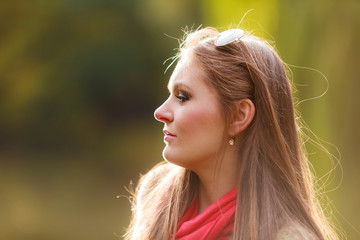 Portrait girl relaxing walking in autumnal park.