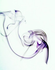 Incense smoke rising on pale background