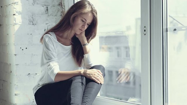Feeling of sadness of young beautiful girl