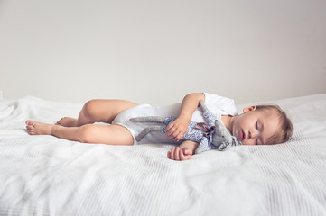 Baby sleep with teddy bear.
