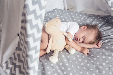 Sleeping baby in teepee © mallmo