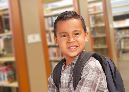 Hispanic Student Boy with Backpack in the Library