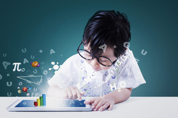 Cute girl uses tablet with formula