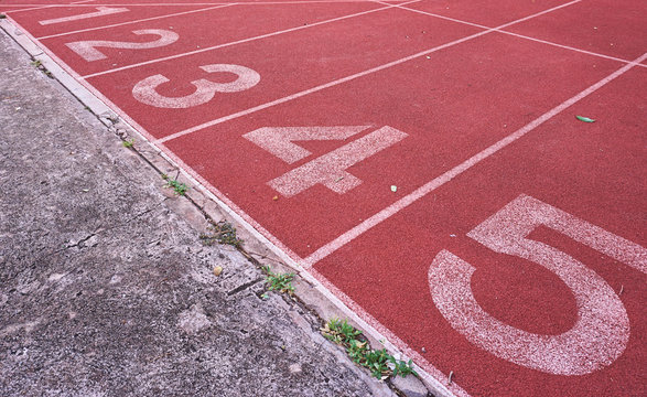 Numbers on running tracks in athletic stadium.