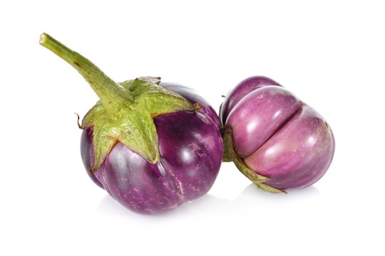 whole eggplant with stem on white background