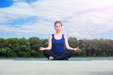 Fototapeta na wymiar young woman practicing advanced yoga01