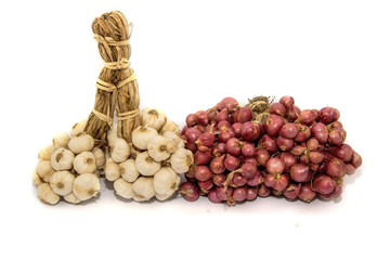 Garlic and shallots on sackcloth background isolated on white