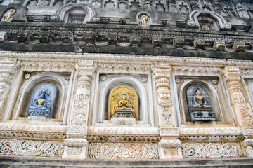 Meditating Buddha Sculpture Carved in Stone at the Mahabodhi Temple Complex in Bodh Gaya, India