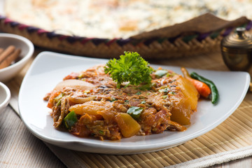 oqda popular arab food, fried potatoes with meat