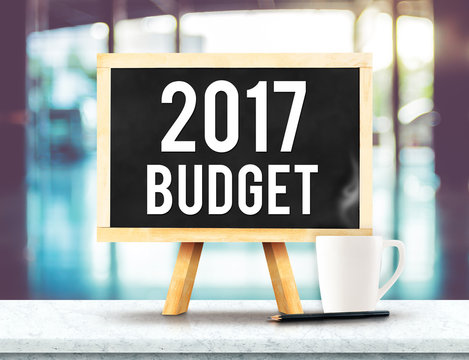 2017 budget on blackboard with easel on black marble table with