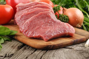 Acrylic kitchen splashbacks Meat Slices of pork with vegetables close up