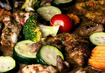 baked chicken breast slices with vegetables in spicy spices