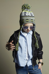 Fototapeta premium child in winter cap.fashionable little boy in sunglasses.stylish kids