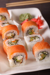 Roll Philadelphia with Fresh Salmon, Cream Cheese and Avocado. Vertical 
