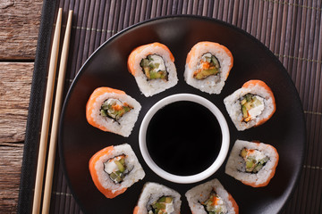 Roll Philadelphia made of Fresh Salmon, Cream Cheese and Avocado. horizontal top view

