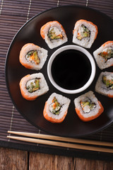 Roll Philadelphia made of Fresh Salmon, Cream Cheese and Avocado. Vertical top view
