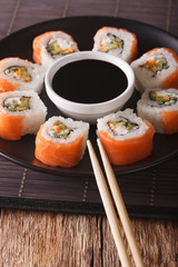 Sushi roll philadelphia and soy sauce, closeup. Vertical
