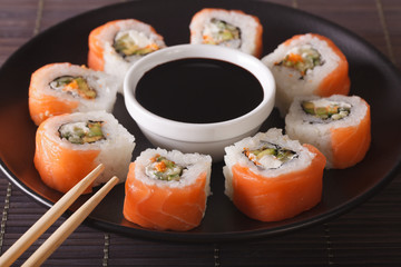Sushi roll philadelphia and soy sauce, closeup. Horizontal
