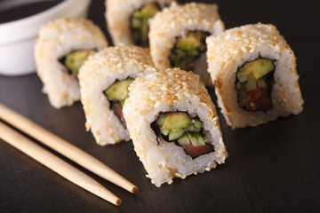 Japanese California rolls with avocado and salmon close up horizontal
