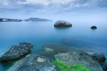 stones in water / bright evening photo summer Crimea