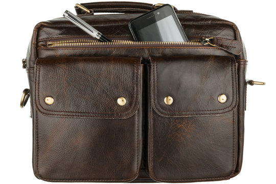 Phone and pen sticking out of his pocket brown leather briefcase