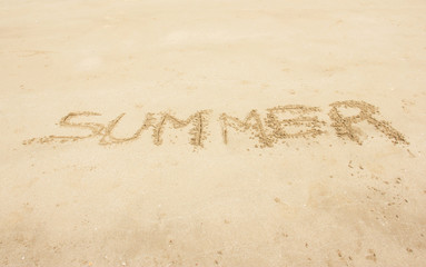 Summer Handwritten On Sand Summer Background Concept