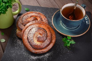 Homemade cream roll and cup of tea