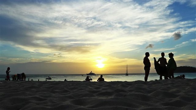 activity of tourist on the beach in sunset time