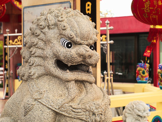 Stone Chinese guardian lion at Dragon Descendants Museum in Suphan Buri, Thailand