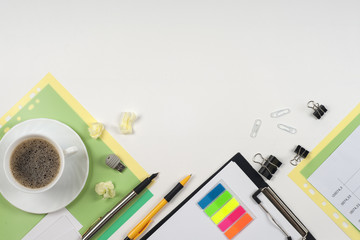 Business blank, notepad, coffee cup and pen at office desk table top view. Corporate stationery branding mock-up