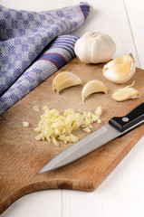 Fototapeta na wymiar chopped garlic on a wooden board
